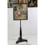 Early Victorian Mahogany Pole Screen, the banner with needlework panel, raised on a platform base