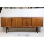 Mid century Retro G-Plan Teak ' Brasilia ' Sideboard, four central drawers, the top one with cutlery