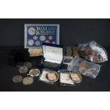 A small collection of British pre decimal and foreign coins to include silver examples.