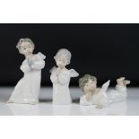 Three Lladro porcelain figures of winged cherubs to include a cherub playing an instrument, cherub