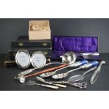 A collection of hallmarked silver and silver plate to include cased cutlery, napkin rings, grape