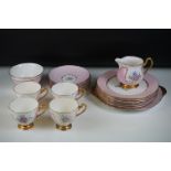 Early 20th Century Shelley hand painted floral tea ware on pink and white ground, with gilt