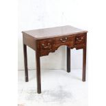 George III Lowboy with three drawers and shaped apron raised on square legs, 78cm wide x 47cm deep x