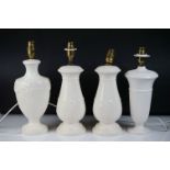 Four Wedgwood Cream Ware porcelain table lamps to include examples with relief foliate and gadrooned