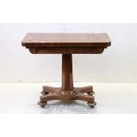 William IV Mahogany Fold-over Card Table raised on an octagonal column support and platform base