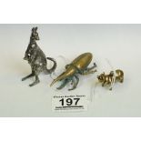 A collection of three ornamental figures to include a brass pig, white metal kangaroo and a brass