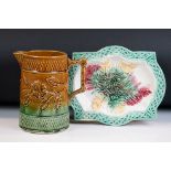 Majolica jug with relief moulded floral and geometric lattice decoration, of tapering cylindrical