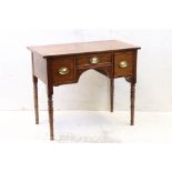 Early 19th century Mahogany Low Boy with Three Drawers, raised on turned tapering legs, 91cm wide