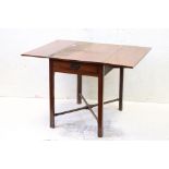 Mahogany Pembroke Table with drawer to end, the square legs united by a turned cross-stretcher, 76cm