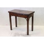 George III Mahogany Fold-over Tea Table of rectangular form, raised on square legs, 83cm wide x 74cm