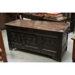 18th century Oak Coffer, the three panels to front with later floral carving, candle tray to