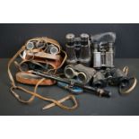 A collection of binoculars to include a pair of Carl Zeiss and military examples.