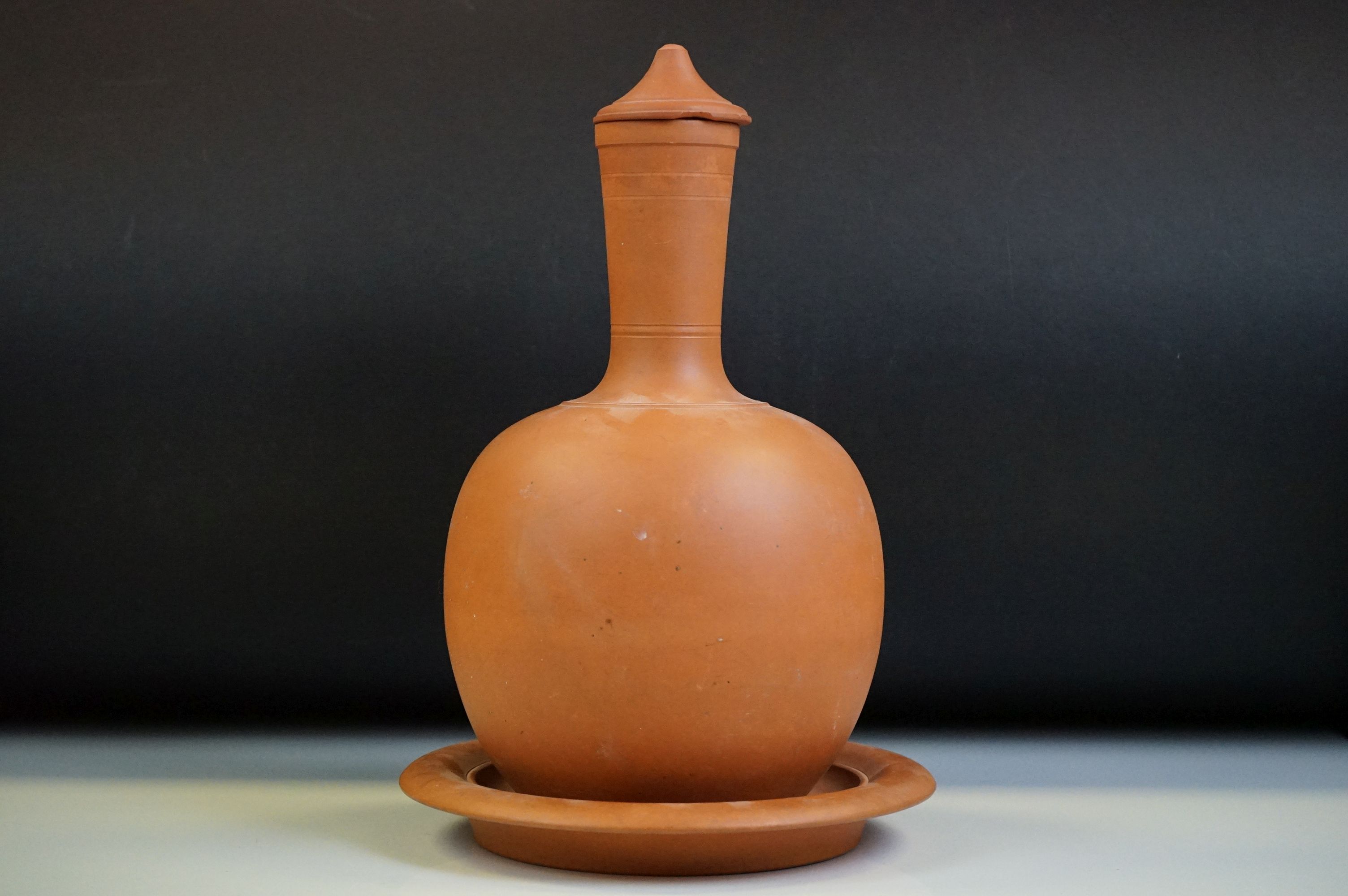 Watcombe of Torquay terracotta bottle vase & cover, ribbed decoration to neck, 27cm high (lid a/