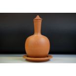 Watcombe of Torquay terracotta bottle vase & cover, ribbed decoration to neck, 27cm high (lid a/