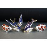 Four Royal Crown Derby paperweights to include Swallow (silver stopper), 16cm long, Blue Dolphin (