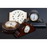 Early 20th century French flame mahogany mantle clock with Arabic numerals on a cream dial with