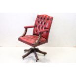 Victorian style Office Swivel Elbow Chair with red button back upholstery, 59cm wide x 108cm high