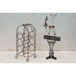 Wrought iron six bottle wine rack with wooden carry handle, 50cm high, together with a ' Bon Appetit