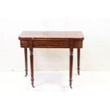 Regency style Inlaid Mahogany and Rosewood Fold-over Tea Table raised on turned reeded tapering