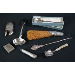 A box of mixed collectables to include hallmarked silver spoon, hallmarked silver ladle,