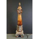 Doulton Lambeth Style lamp base of brown glazed column form, with relief moulded foliate & scrolling
