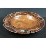 Sam Fanaroff Sussex Guild circular footed copper bowl inset with a green stone cabochon, lobed