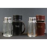 Two Grant's Scotch Whisky travel spirit flask sets, each containing three fitted glass flasks with