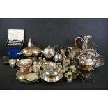 Collection of mixed silver plate and pewter ware to include silver plated cruet sets, kettle on a