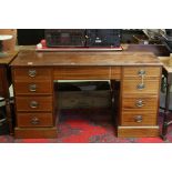 Edwardian style Mahogany Inlaid Twin Pedestal Desk with an arrangement on nine drawers raised on