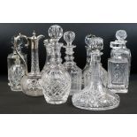 Ten 20th century cut and moulded glass & crystal decanters with stoppers to include 3 x ships