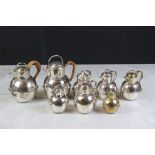 Eight Silver Plated Guernsey Milk Jugs of various sizes, tallest 19cm high