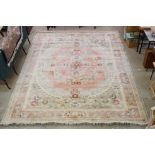 Large Chinese Pink, Pale Green and Cream Ground Rug with floral decoration, approx. 370cm x 276cm