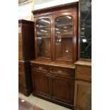 Victorian Mahogany Bookcase, the upper section with two arched glazed doors opening to three