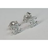 Pair of silver & CZ designer style stud earrings