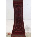 A hand knotted wool Meshwani runner, measures approx 250cm x 56cm