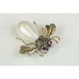 Silver and marcasite brooch in the form of a bug with ruby eyes