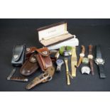 A small group of collectables to include a quantity of wristwatches, Victorinox penknife holders and