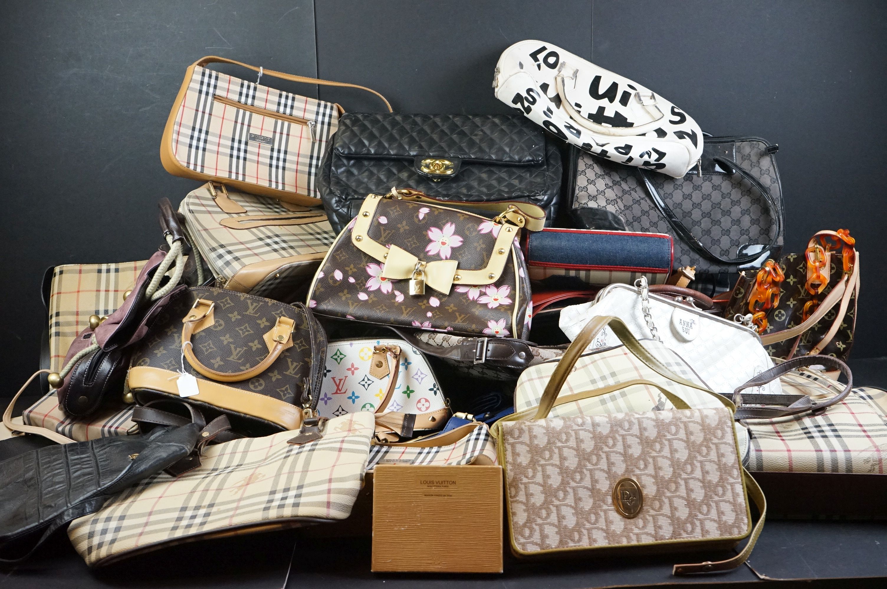 A very large collection of handbags and shoulder bags contained within two large boxes.
