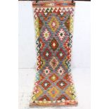 A hand knotted wool chobi kilim runner, measures approx 203cm x 66cm