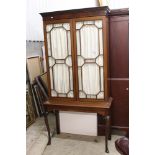 Early 20th century Mahogany Display Cabinet, the fabric lined twin astragel glazed doors opening