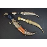 A collection of three contemporary arabic Jambiya Curved Daggers