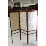 Edwardian Three Fold Screen, the wooden frame with painted decoration and inset with cream silk