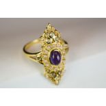 Gold plate on silver ring, set with central amethyst cabochon