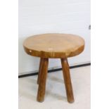 Rustic Polished Elm Circular Table, the top made from a single slice of trunk, raised on four turned