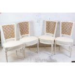 Set of Four French Dining Chairs in the Early 19th century style, distressed white painted finish,