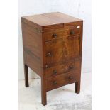 George III Mahogany and String Inlaid enclosed Washstand, the double hinged lid opening to a