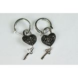Pair of silver and CZ heart shaped drop earrings
