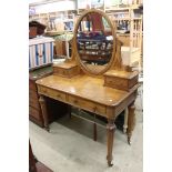 Victorian Walnut Dressing Table, oval swing mirror and two small drawers over two further drawers,