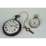 An antique fully hallmarked sterling silver pair cased pocket watch together with a silver ladies