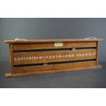 A vintage wooden wall hanging snooker / billiard score board.